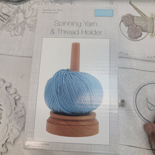 Spinning yarn and thread holder